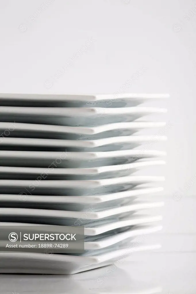 Stack Of White Square Plates On A White Background