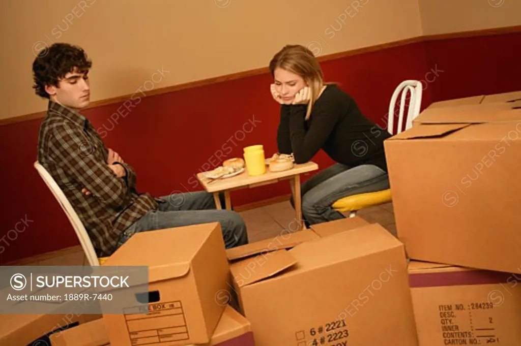Couple living out of boxes