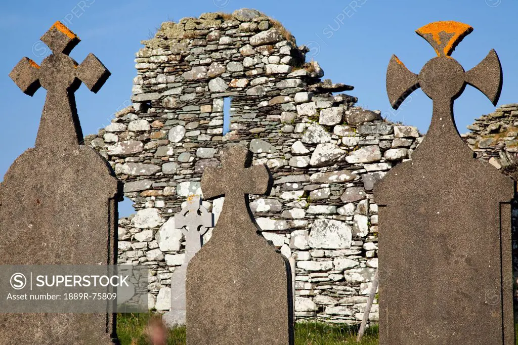 Tombstones In Front Of An Old Stone Wall Near Eyeries, County Cork Ireland