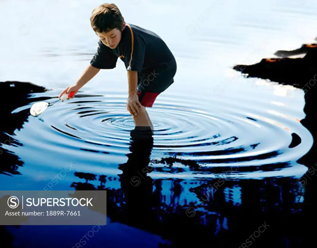 Boy playing in the water