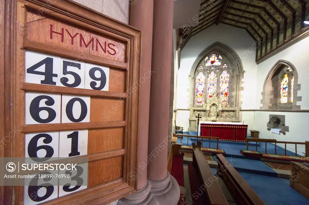 Hymn numbers posted on a wooden board in st. andrew´s church, kelso scottish borders scotland