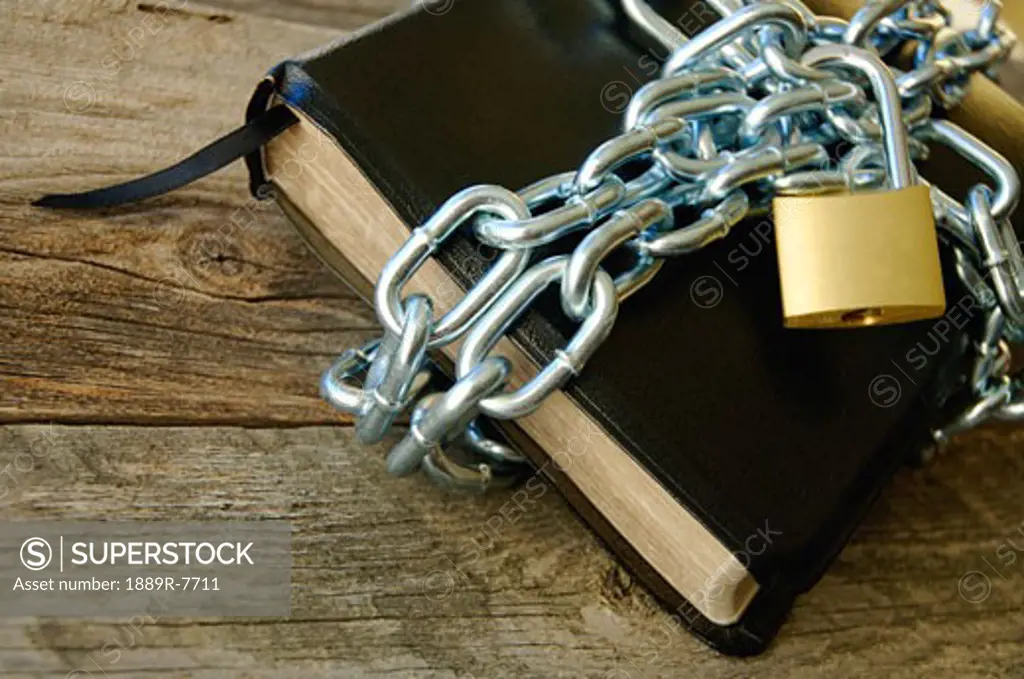 Book with lock and chains