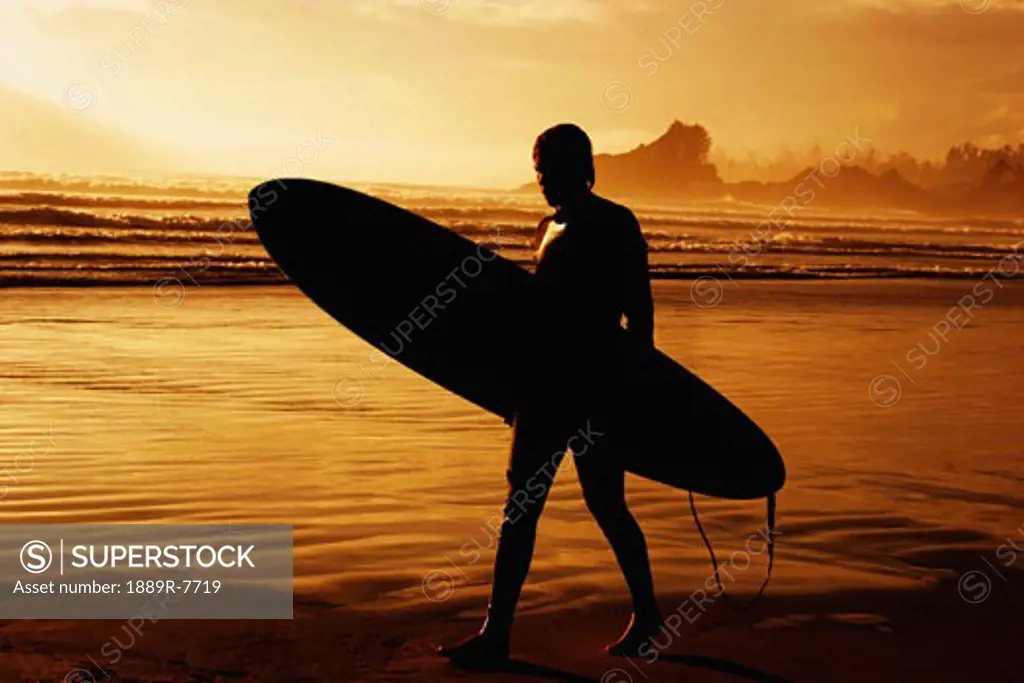 Silhouette of a surfer on the beach