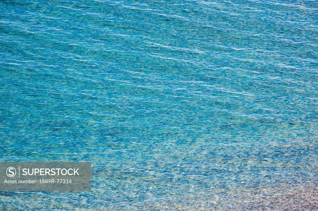 Small Waves Gently Rippling In To Shore, Nerja Malaga Province Spain