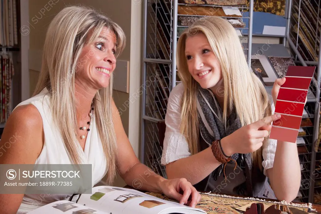 mother and daughter discussing colours and samples for remodelling of home, edmonton, alberta, canada