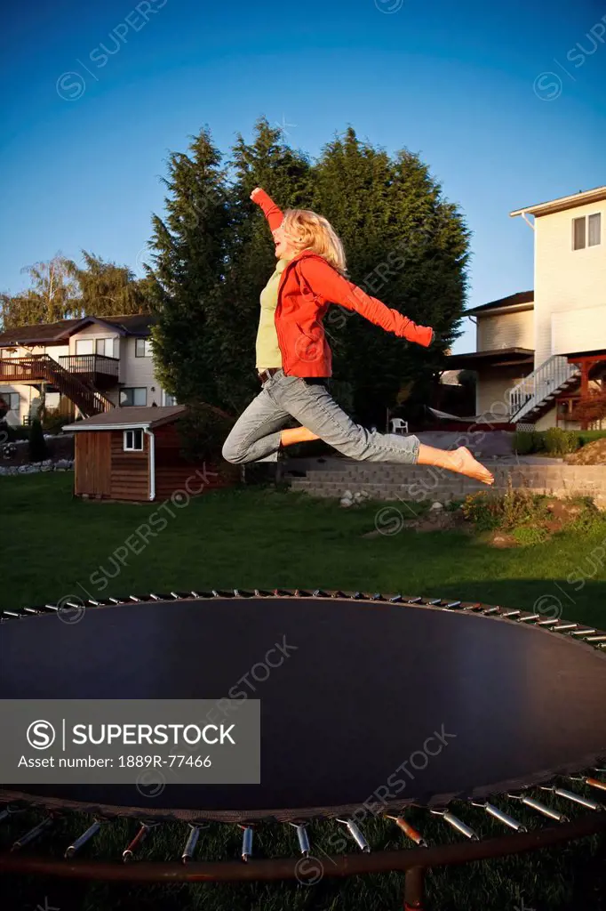 woman jumps on a trampoline, ferndale, washington, united states of america