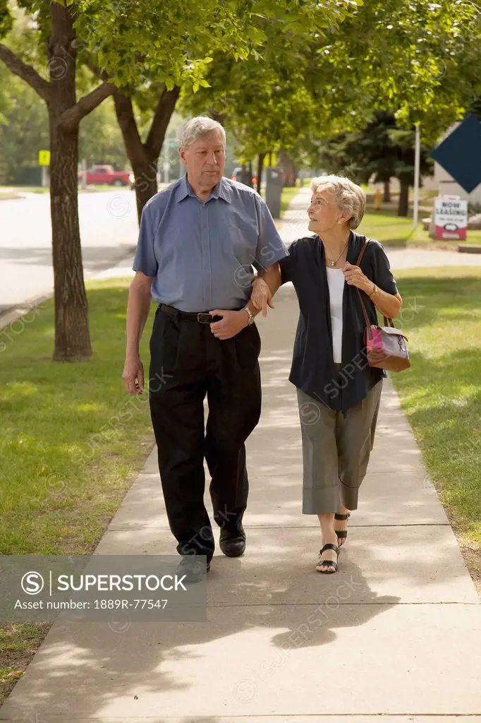 a senior couple walking together, edmonton, alberta, canada