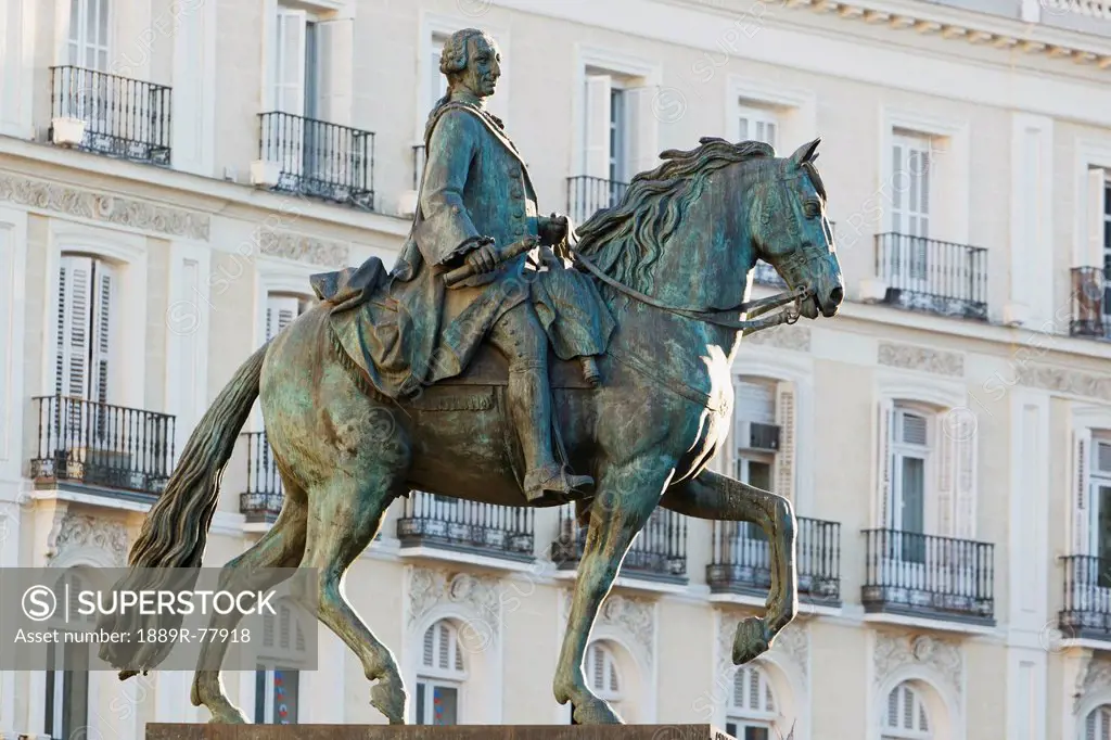 Equestrian statue of king carlos iii at puerta del sol, madrid spain
