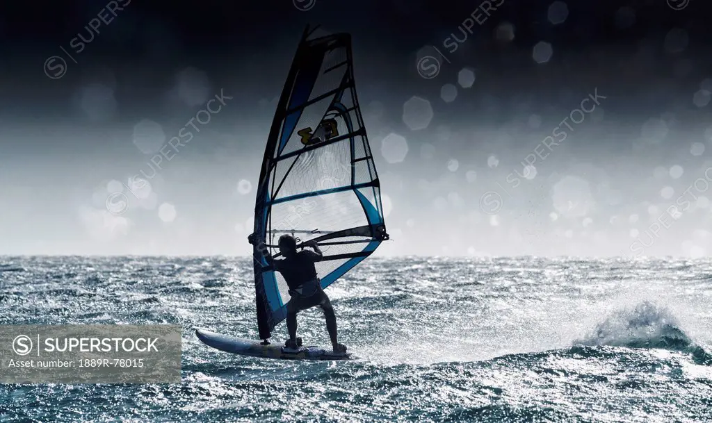 Windsurfing with water drops on camera lens, tarifa cadiz andalusia spain