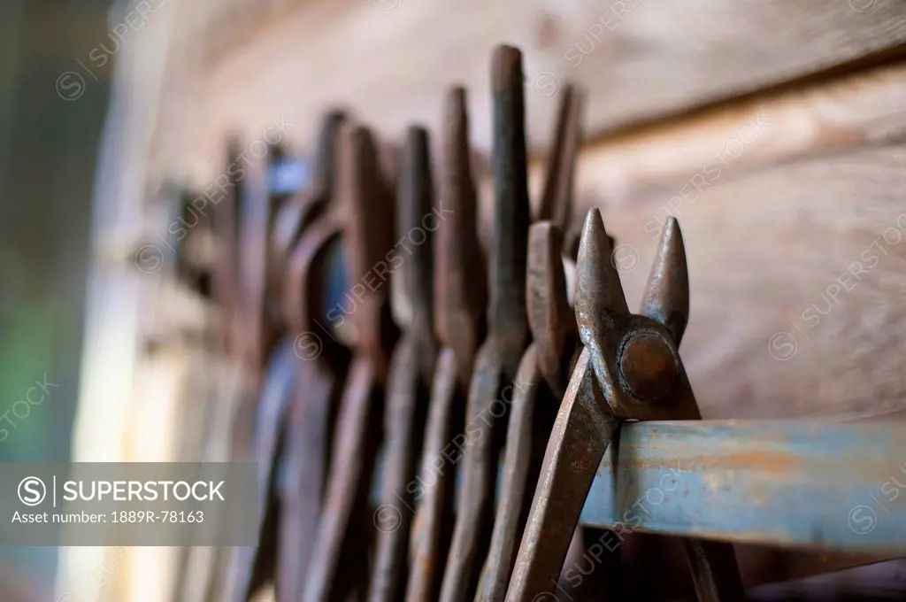 Old rusted tools on a wooden shelf, saanichton british columbia canada