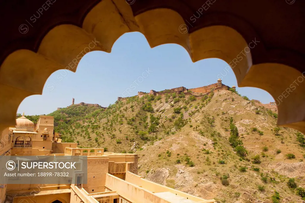 View through a sculpted archway in amer fort, jaipur rajasthan india