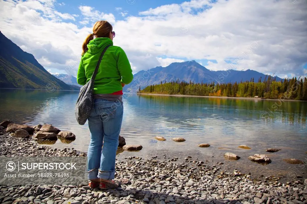 a young woman at kathleen lake, haines junction, yukon, canada