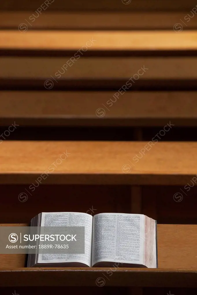 An open bible on a wooden ledge, howick northumberland england