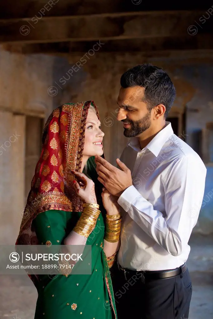 A mixed race couple with her wearing a sari and headscarf, ludhiana punjab india