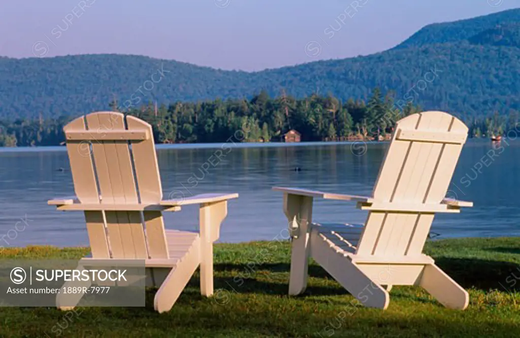 Two chairs by waterside