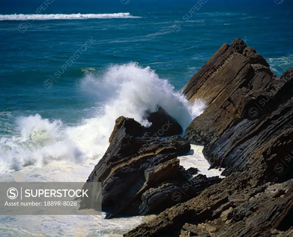 Atlantic Ocean waves break on a rugged Portugeuse coastline