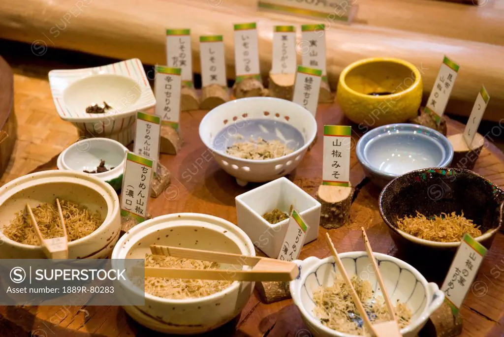 Tray of various traditional japanese dishes on a street market, kyoto, japan