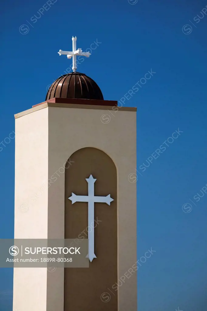A coptic orthodox church tower with blue sky, alberta canada