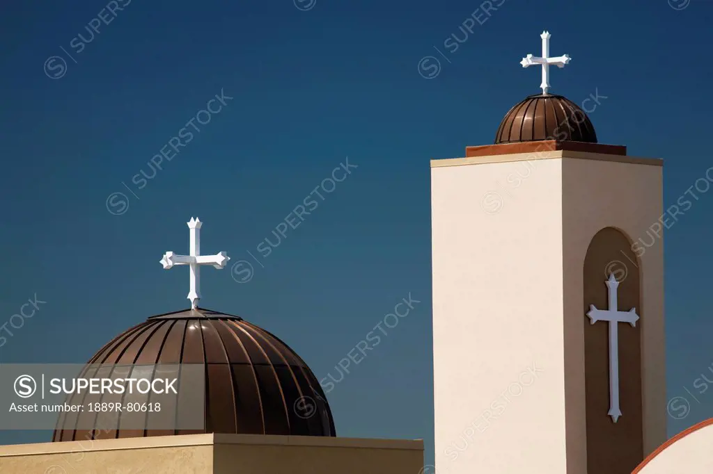 A coptic orthodox church tower and dome with blue sky, alberta canada