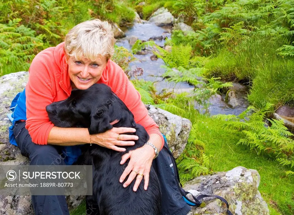 A woman with her dog, ullswater cumbria england