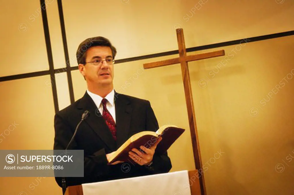 Pastor preaching from pulpit