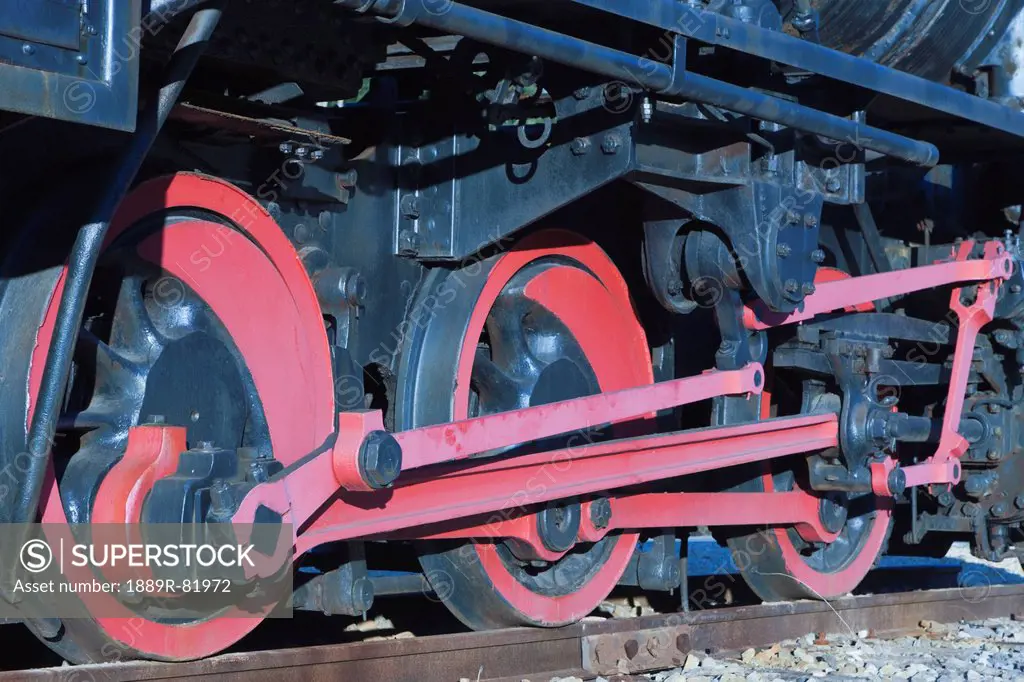 Detail of wheels and running gear of a steam locomotive set up as monument, minas de rio tinto, huelva province, andalusia, spain