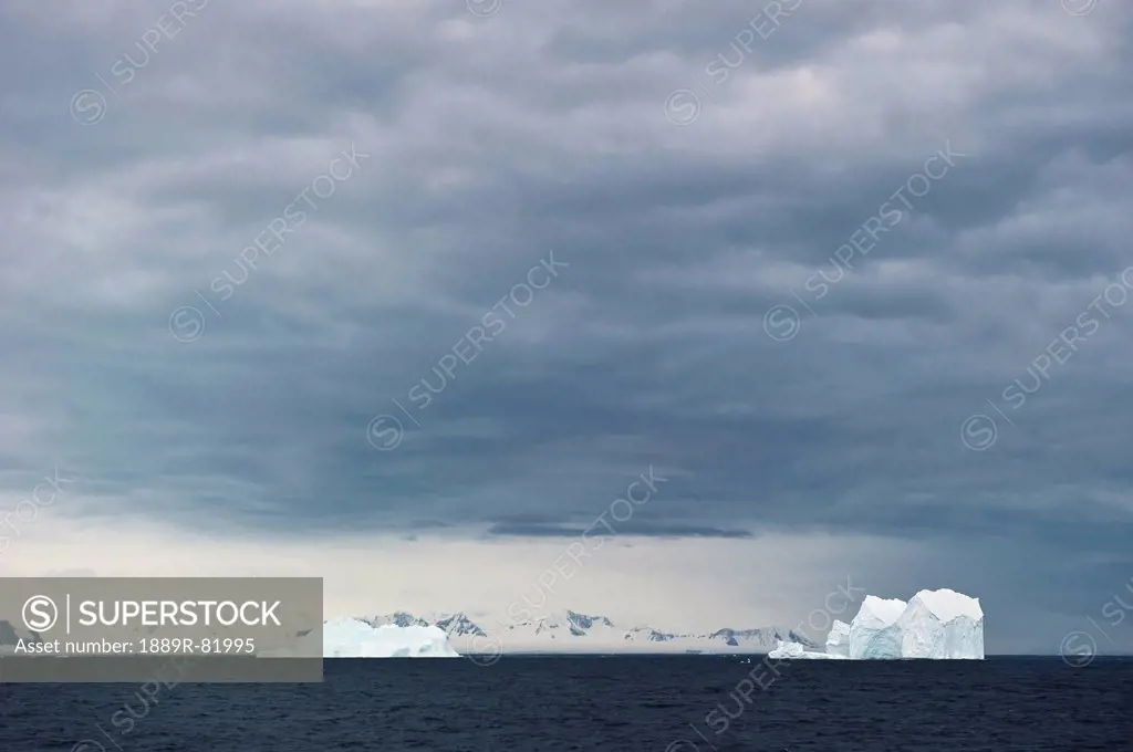 Icebergs under a cloudy sky, antarctica