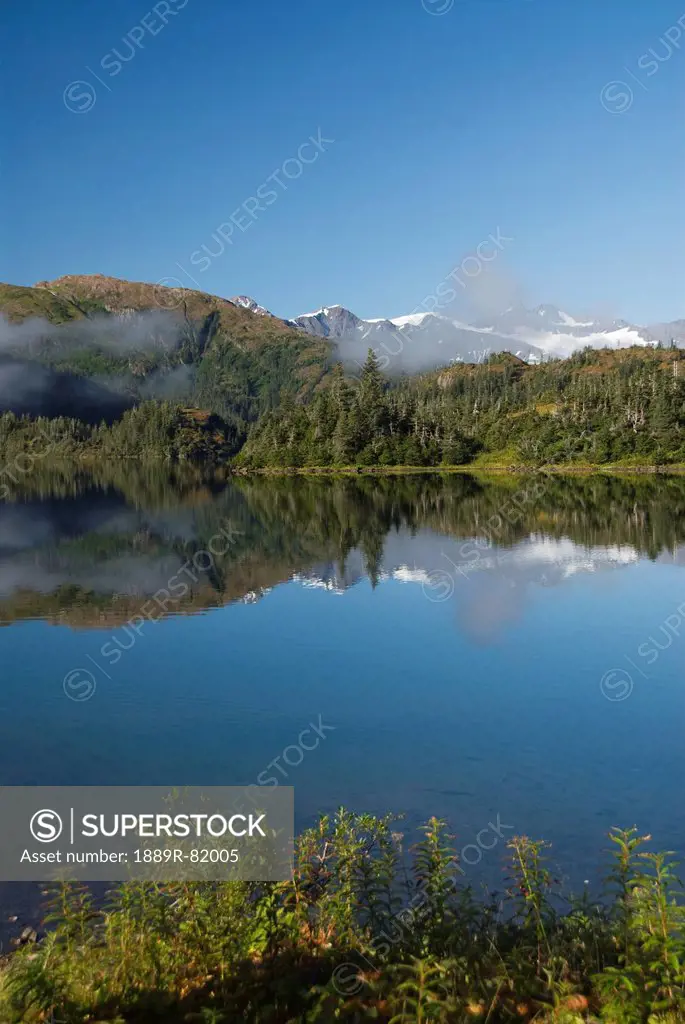 Shrode lake with low lying fog, prince william sound, alaska, united states of america