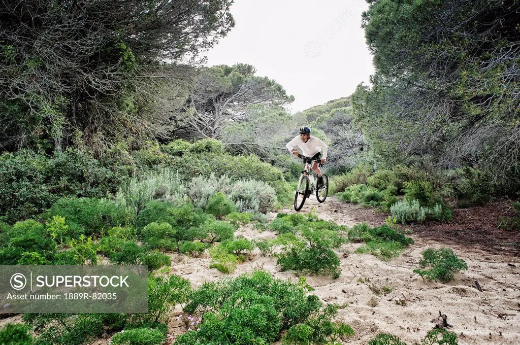 Cycling over rugged terrain, tarifa, cadiz, andalusia, spain