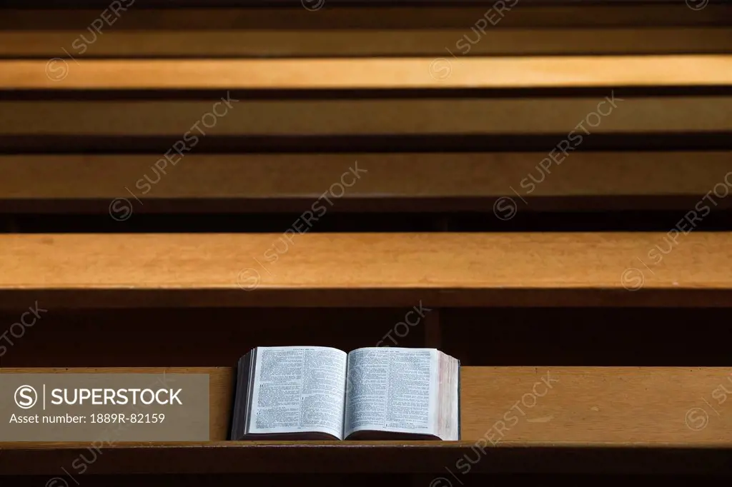 A bible open on a wooden bench, northumberland, england