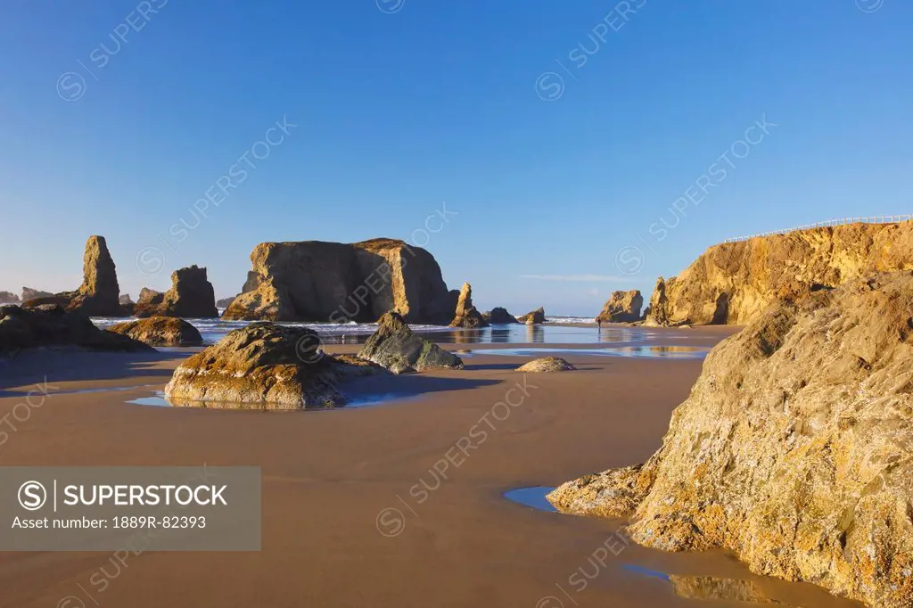 Rock formations at low tide on bandon beach, oregon, united states of america