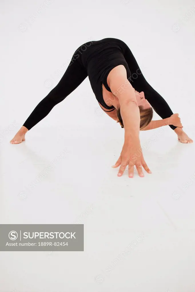 A woman in a yoga pose, tarifa, cadiz, andalusia, spain