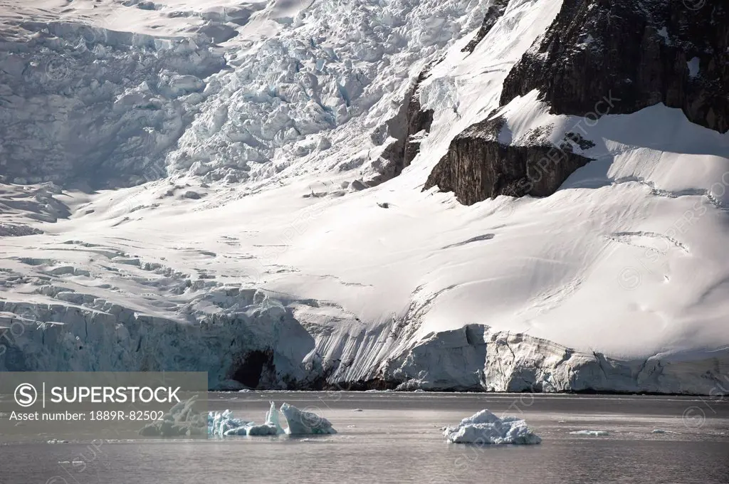 Snow, icebergs and glaciers along the coastline, antarctica