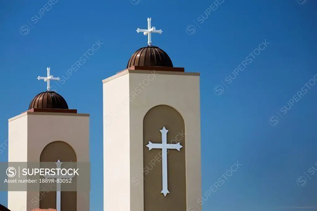 Two coptic orthodox church towers with blue sky, alberta canada
