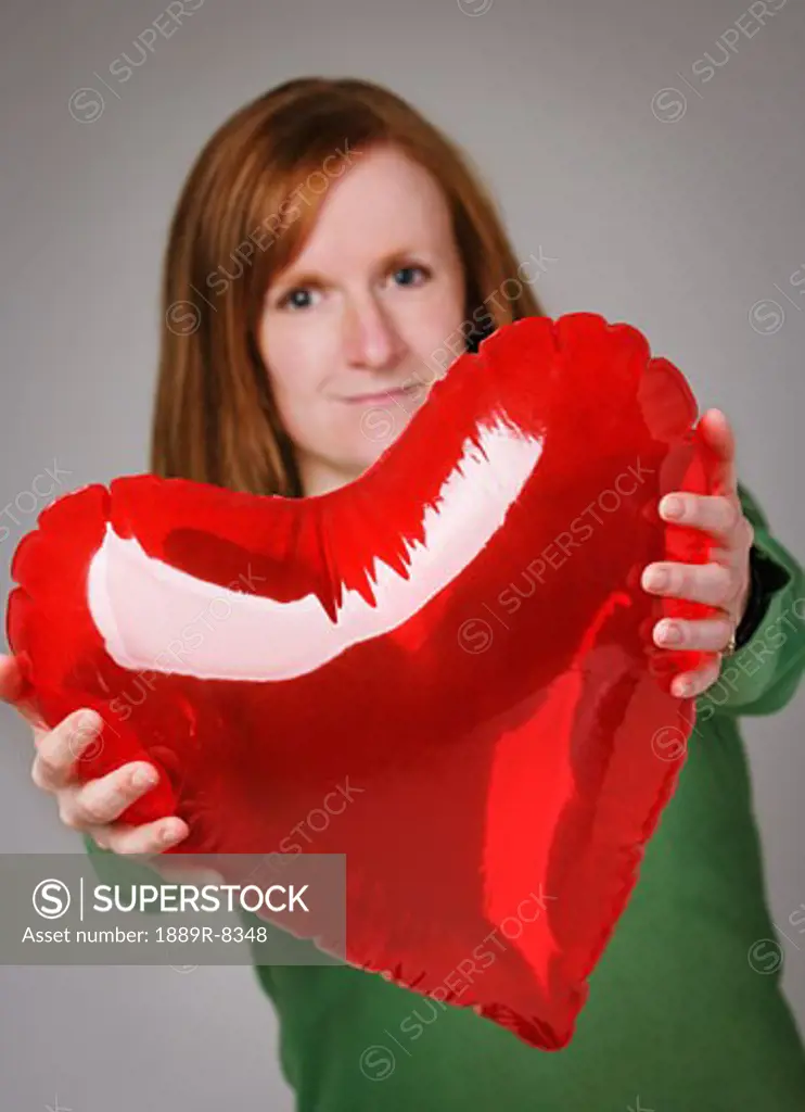 Woman giving heart