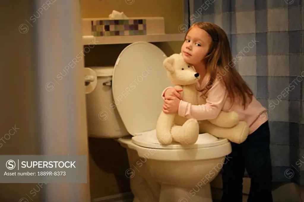 Child encourages bear to go potty