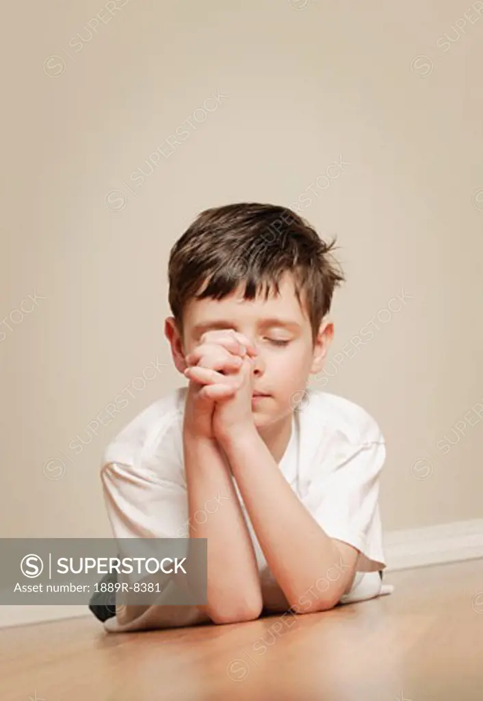 Young boy praying