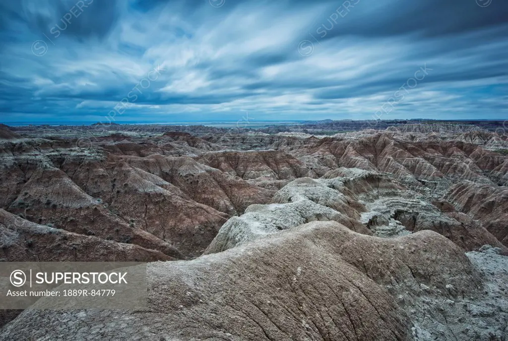 Long exposure of clouds overtop of badlands national park, south dakota united states of america