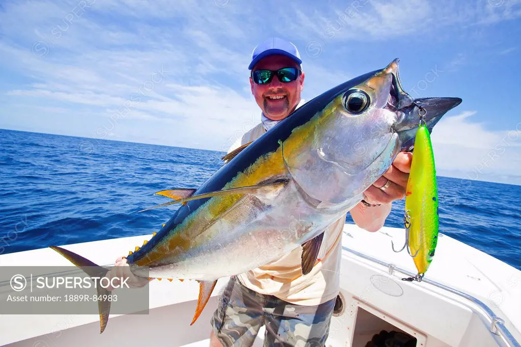 Man holding just caught yellowfin, panama