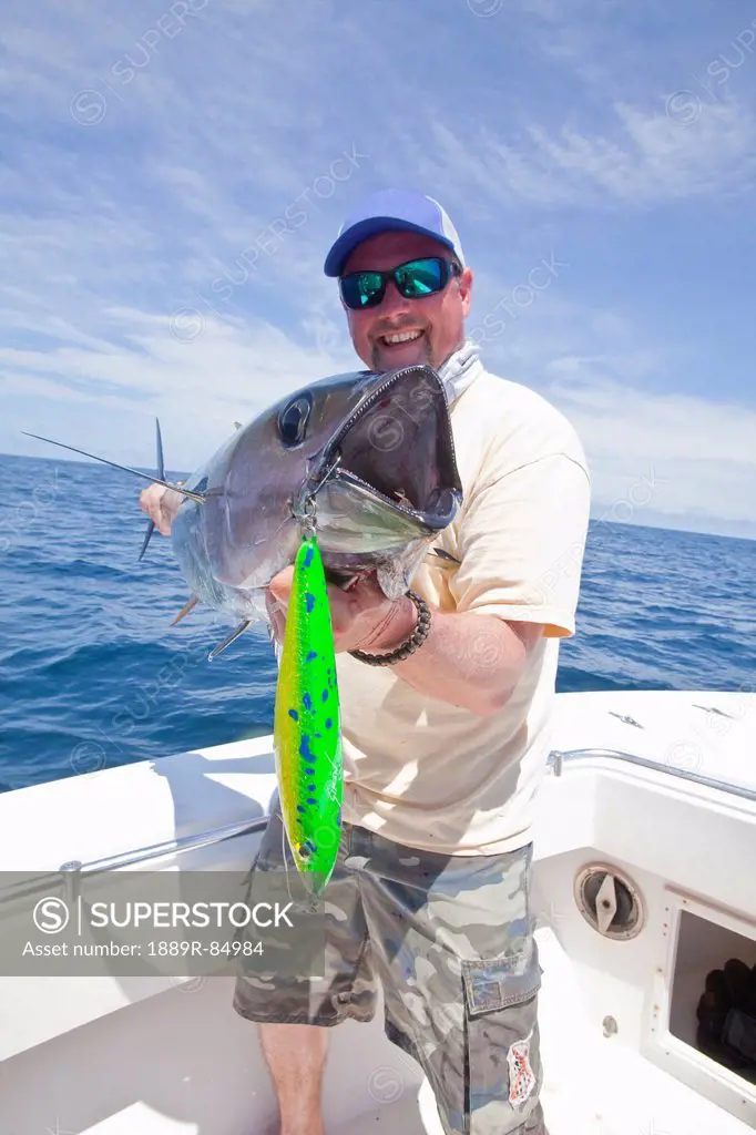Man holding just caught yellowfin tuna, panama