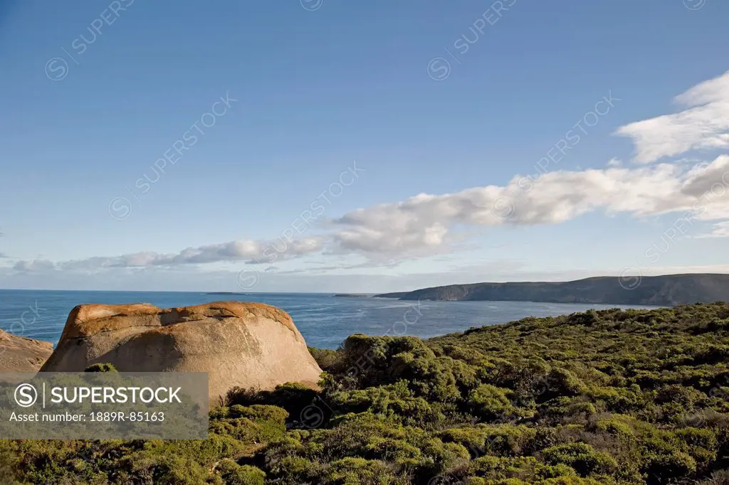 A large rock formation on the shore along the coast, australia