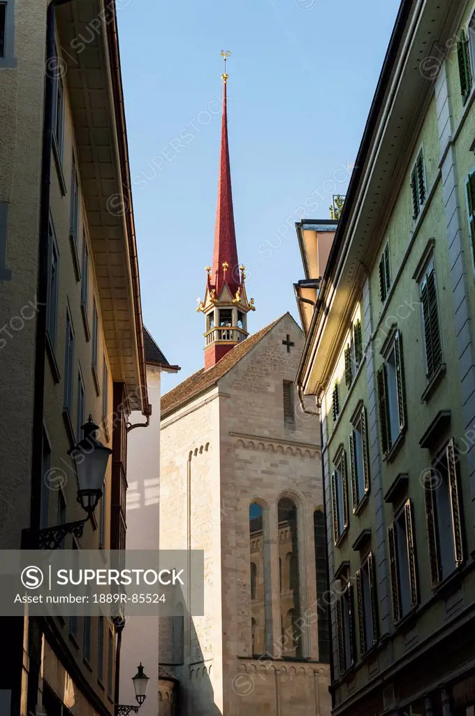 Various Buildings And A Red Steeple Against A Blue Sky, Zurich Switzerland