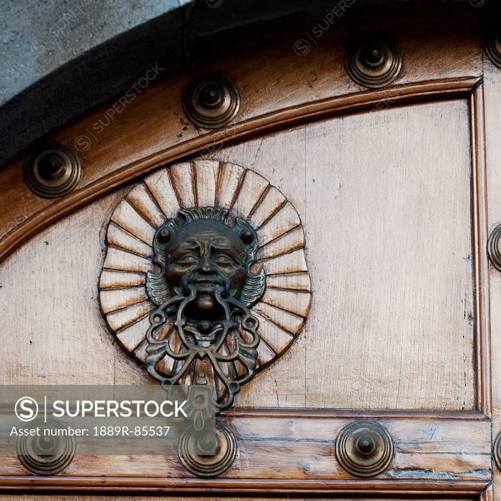 A Human Face As A Door Knocker And Decorative Rivets On A Door, Guatemala City Guatemala
