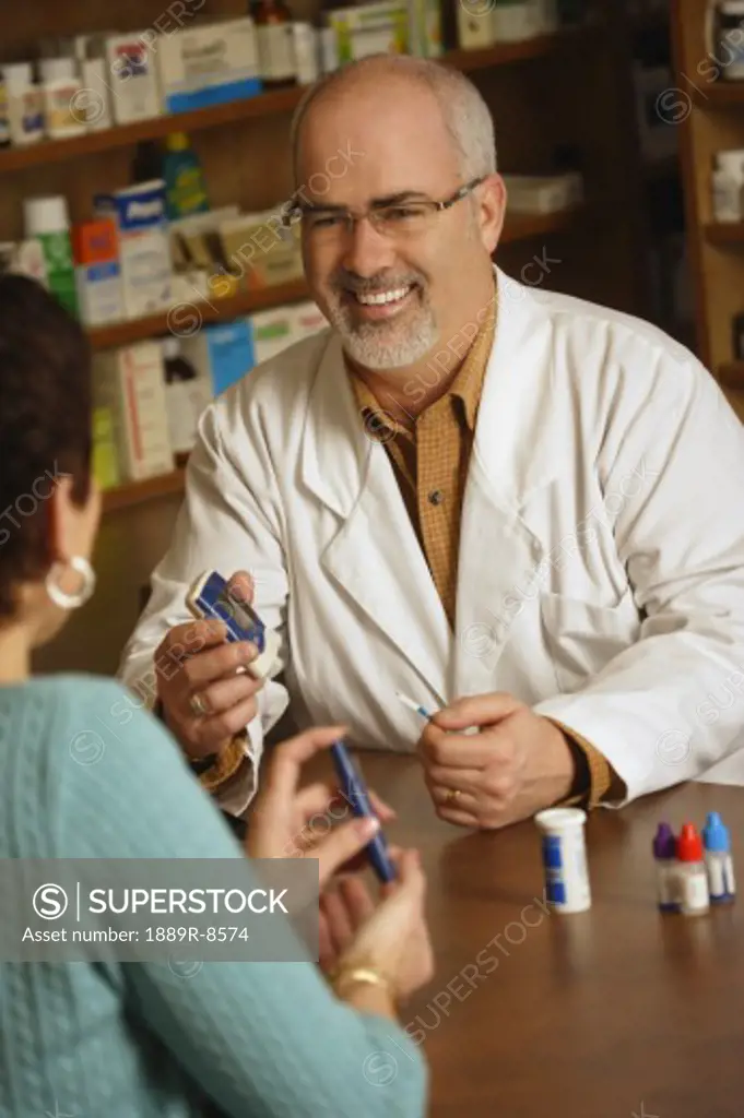 Pharmacist with patient