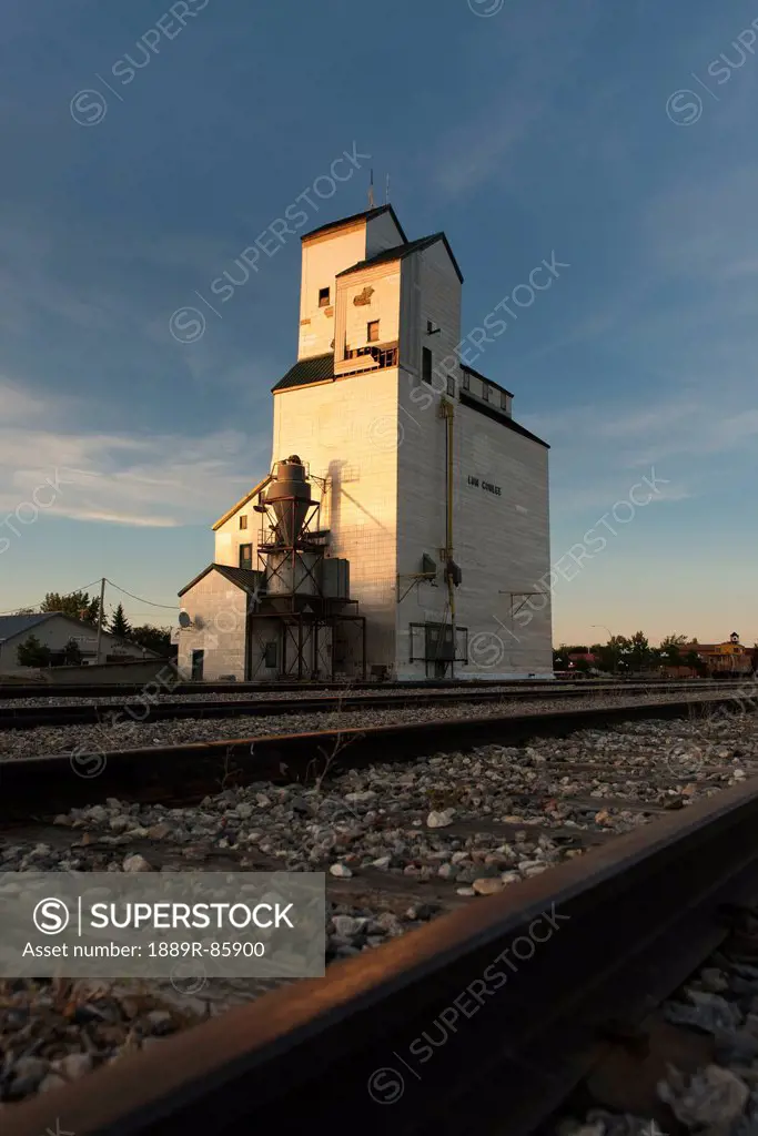 Grain Elevator And Train Tracks, Plum Coulee Manitoba Canada