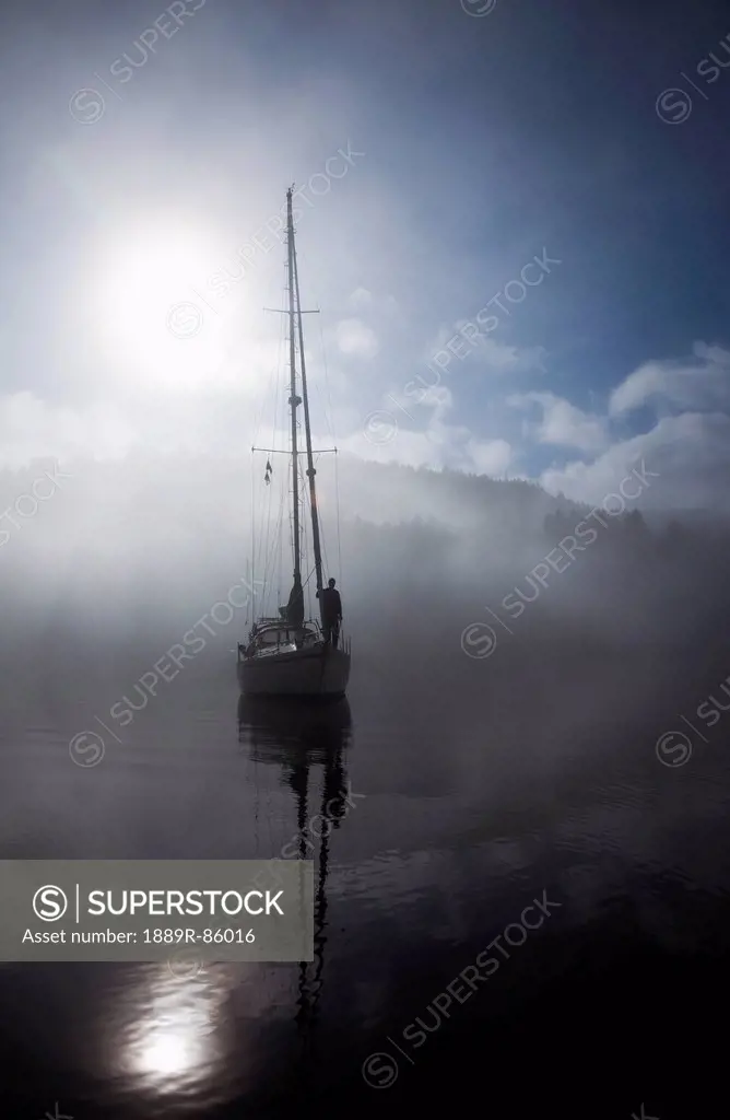 A Sailboat At Anchored In The Fog In The Gulf Islands, British Columbia Canada