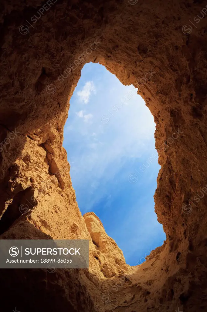 A Opening In A Cave Looking Up To The Blue Sky, Israel