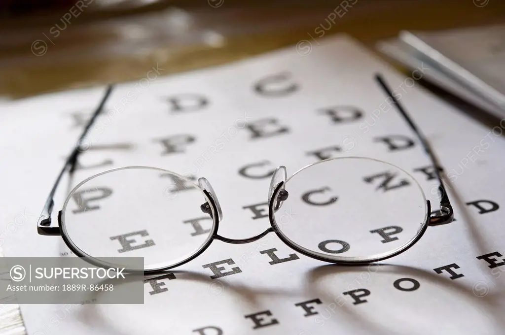 Eyeglasses Resting On A Vision Testing Chart;Edmonton Alberta Canada