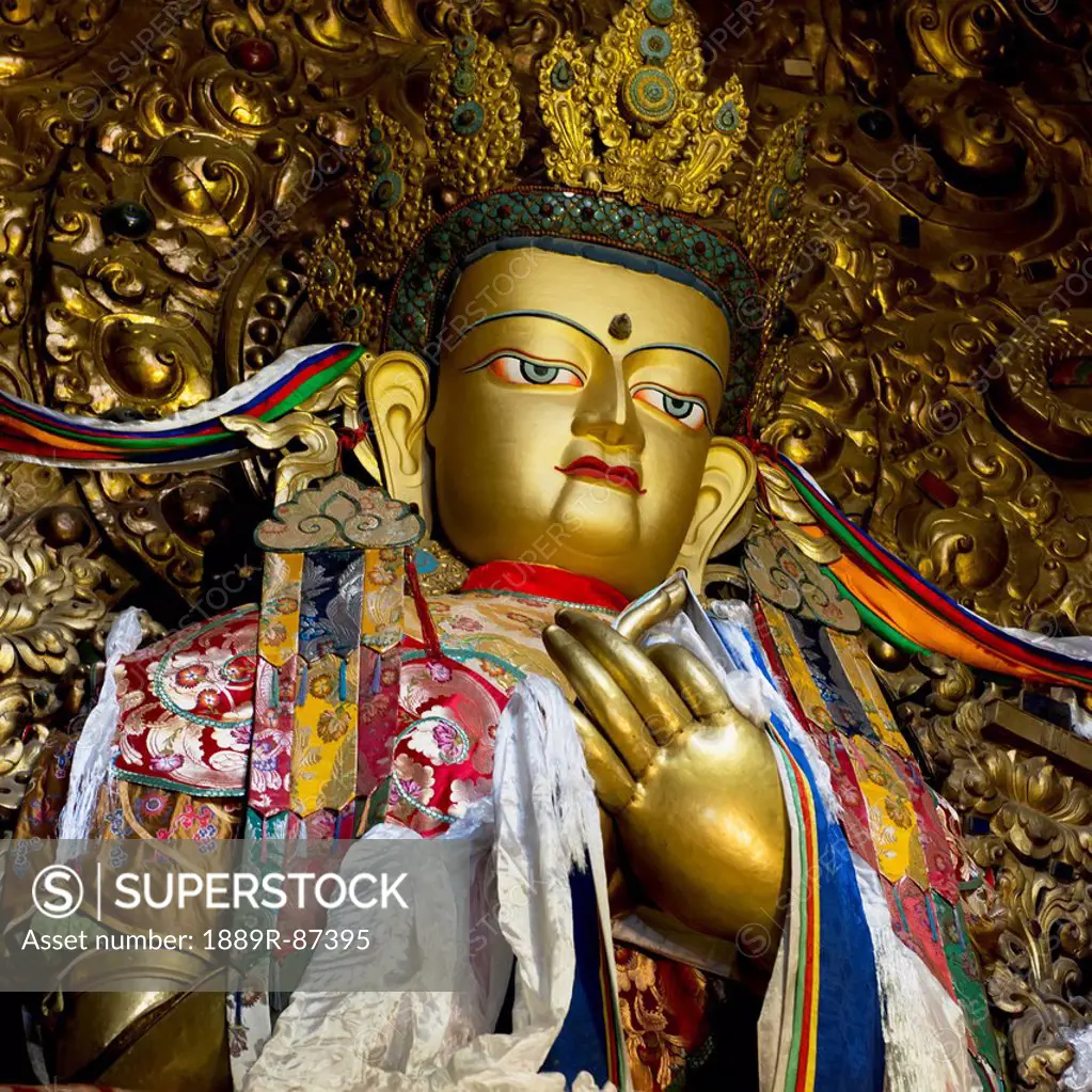 Gold statue with colourful decor in drepung monastery;Lhasa xizang china