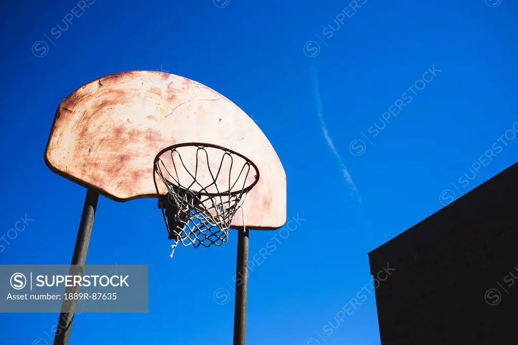Rusty Basketball Hoop Against A Blue Sky;Beloeil Quebec Canada